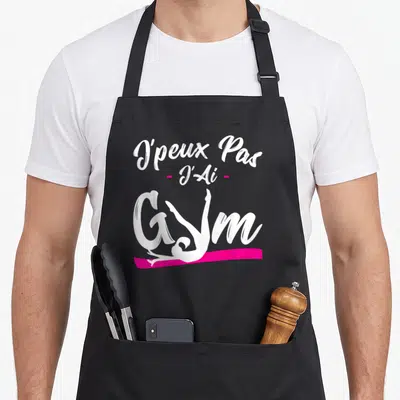 Tablier de cuisine noir avec inscription J'peux Pas J'ai Gym et silhouette femme en yoga rose