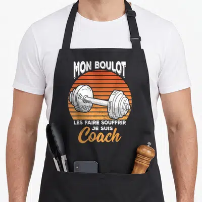 Tablier de cuisine noir avec illustration de barbell orange et texte Mon Boulot C'est Coach Je Suis Les Faire Souffrir