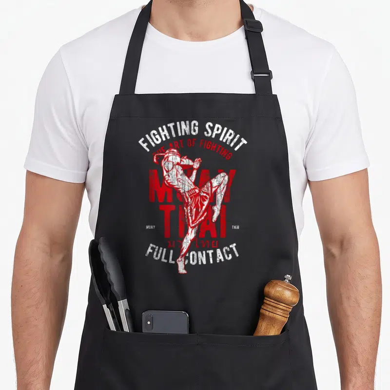 Tablier de cuisine noir avec illustration rouge et blanche d'un lutteur de Muay Thai et du texte Fighting Spirit Full Contact.