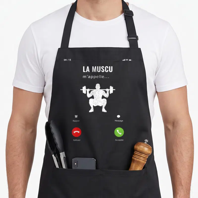 Tablier de cuisine noir avec illustration blanche d'un appel téléphonique montrant un homme en train de faire du squat avec une barre de poids.