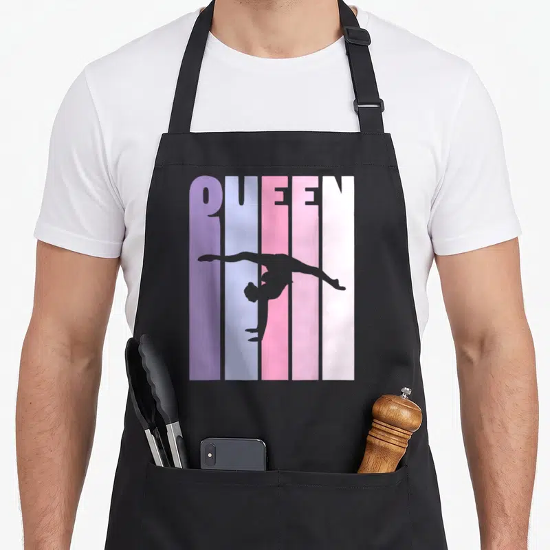 Tablier de cuisine noir avec silhouette gymnaste et texte QUEEN coloré vertical