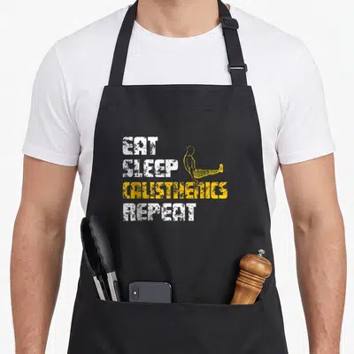 Tablier de cuisine noir avec texte Eat Sleep Calisthenics Repeat et silhouette jaune effectuant un L-Sit.