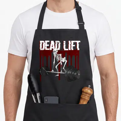 Tablier de cuisine noir avec squelette soulevant une barre et texte Dead Lift en blanc.