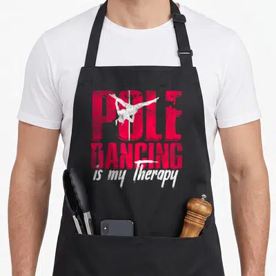 Tablier de cuisine noir avec l'inscription Pole Dancing is my Therapy et une silhouette blanche sur perche.