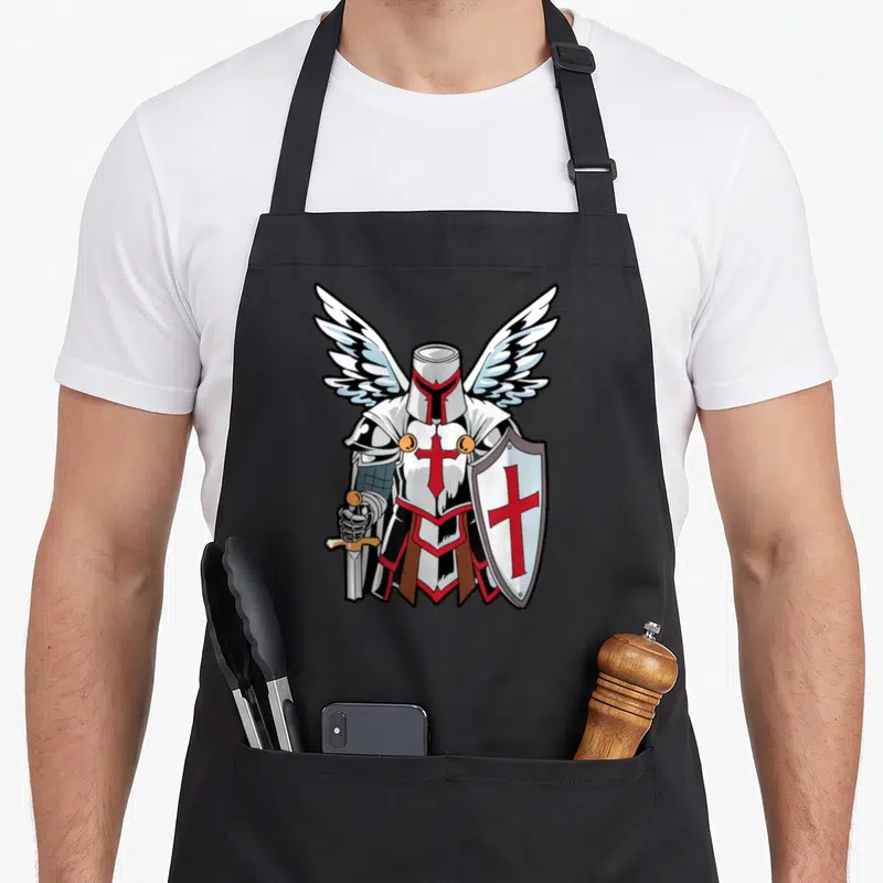 Tablier de cuisine noir avec illustration d'un chevalier Templiers aux ailes blanches tenant une croix rouge et un bouclier.