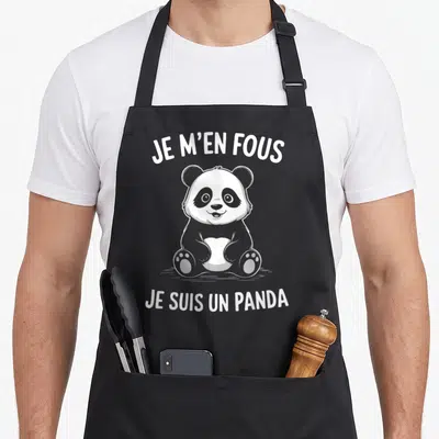 Tablier de cuisine noir avec un panda dessiné en blanc et le texte Je m'en fous je suis un panda.
