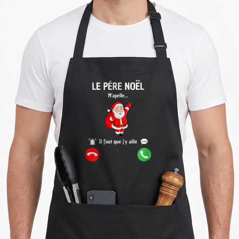 Tablier de cuisine noir avec illustration d'un père Noël levant la main et des boutons d'appel téléphonique rouge et vert.