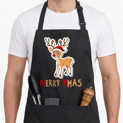 Tablier de cuisine noir avec un renard dessiné portant un chapeau rouge et l'inscription Merry Xmas en bas.