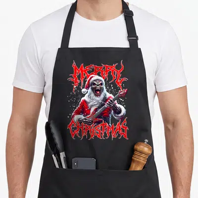 Tablier de cuisine noir avec un Père Noël squelette jouant de la guitare et du texte Merry Christmas en style heavy metal.