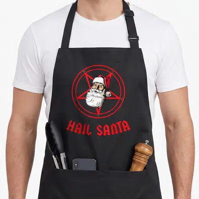 Tablier de cuisine noir avec un Père Noël dans un pentagramme rouge et l'inscription Hail Santa en typographie gothique.