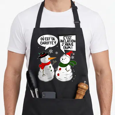 Tablier de cuisine noir avec deux bonhommes de neige et les textes où est ta carotte et c'est inflation j'avais faim.