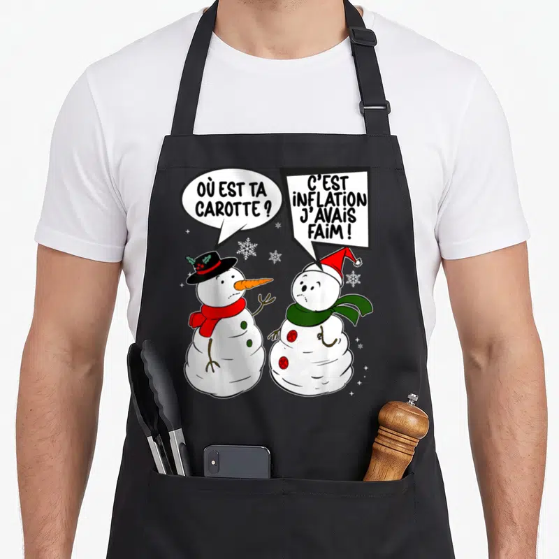 Tablier de cuisine noir avec deux bonhommes de neige et les textes où est ta carotte et c'est inflation j'avais faim.