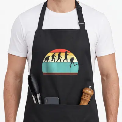 Tablier de cuisine noir avec illustration évolutive d'un homme transformé en plongeur sur fond arc-en-ciel rétro.