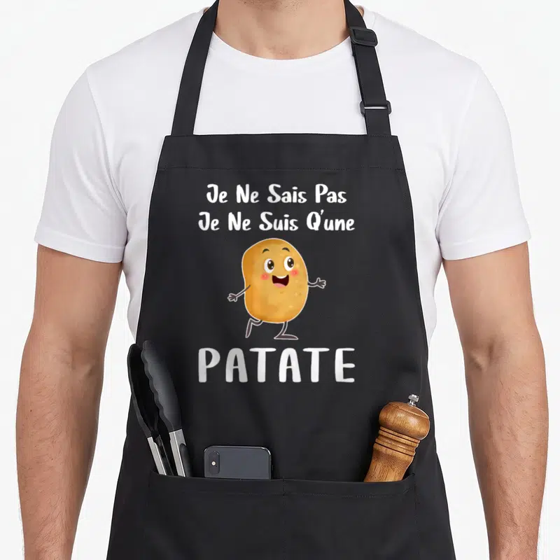 Tablier de cuisine noir avec une patate souriante et le texte Je Ne Sais Pas Je Ne Suis Qu'une Patate en blanc.