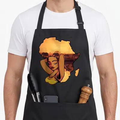 Tablier de cuisine noir avec illustration d'une femme et silhouette du continent africain aux couleurs chaudes.
