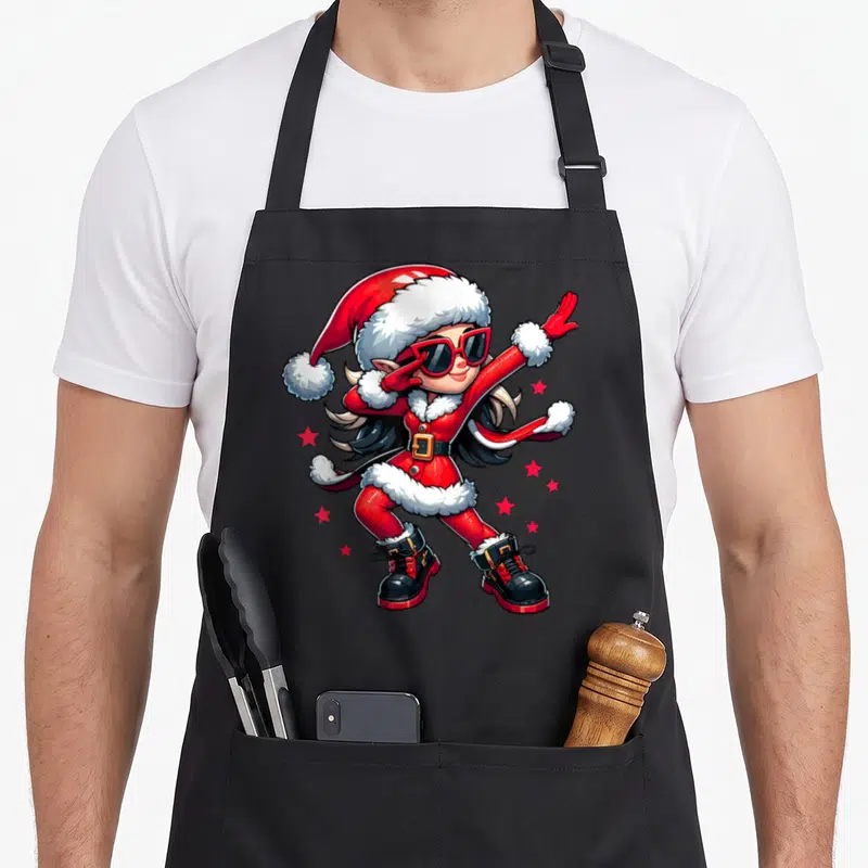 Tablier de cuisine noir avec une fée de Noël aux lunettes de soleil et bottines noires entourée d'étoiles roses.