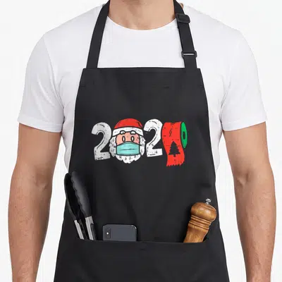 Tablier de cuisine noir avec illustration 2020 Père Noël masqué et rouleau de papier hygiénine rouge à l'effigie d'un sapin.