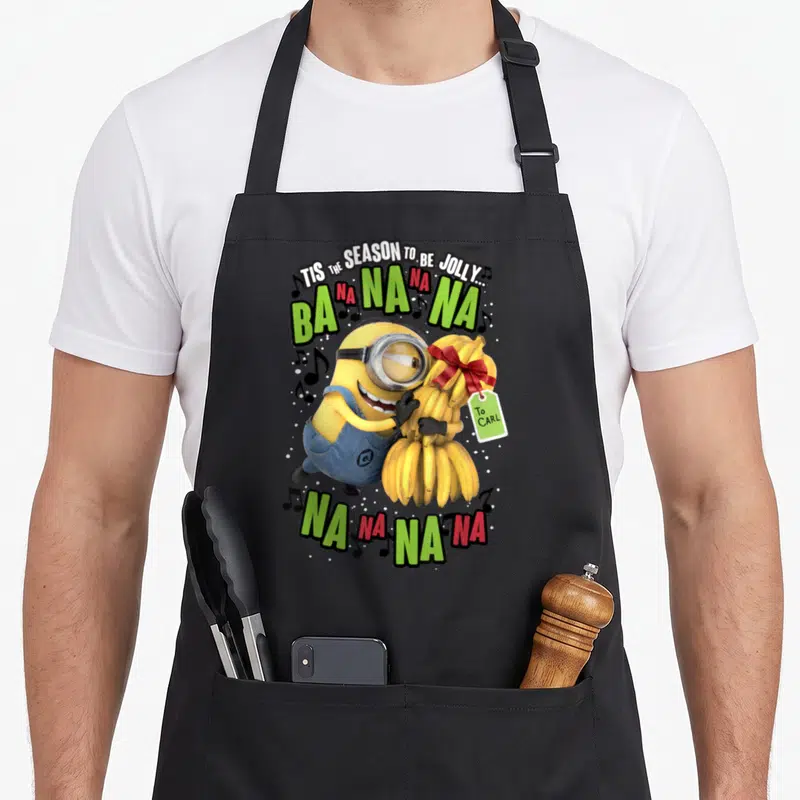 Tablier de cuisine noir avec un Minion tenant des bananas et l'inscription Ba na na na.