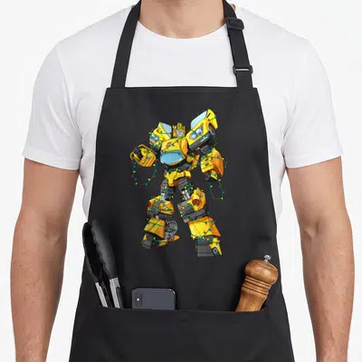 Tablier de cuisine noir avec Bumblebee robot jaune enroulé dans des guirlandes lumineuses colorées.