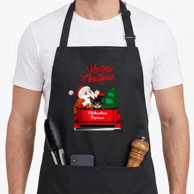 Tablier de cuisine noir avec illustration d'un Père Noël et d'un Chihuahua dans un camion rouge portant l'inscription Chihuahua Express.