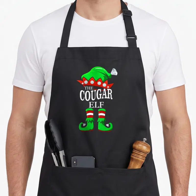 Tablier de cuisine noir avec illustration d'un elfe aux bottes vertes et chapeau orné de diamants