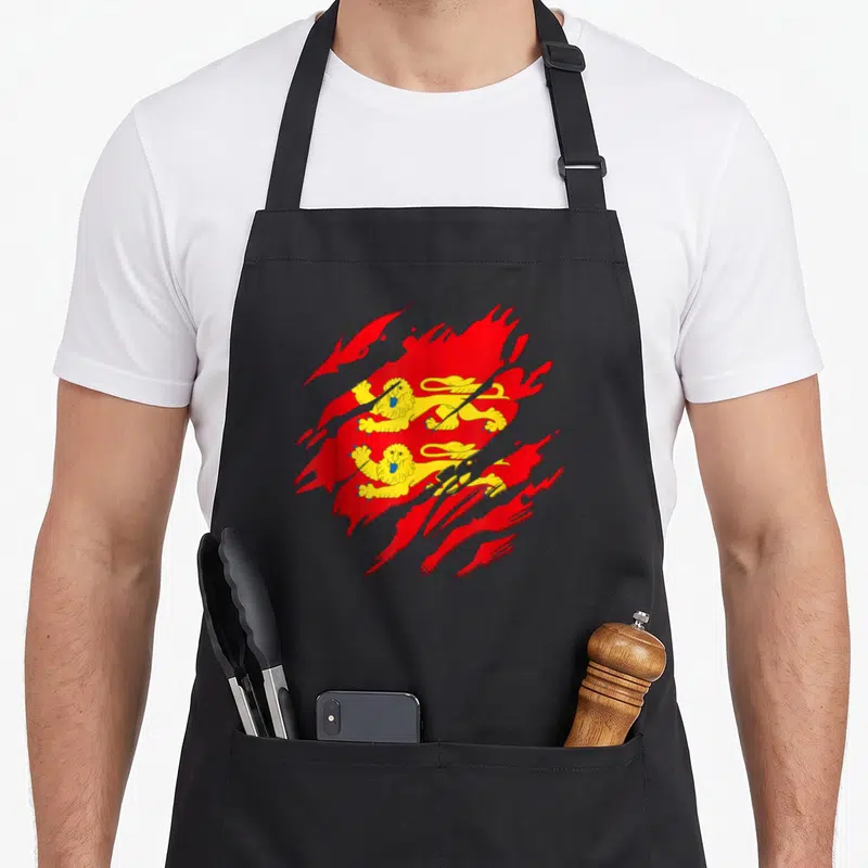 Tablier de cuisine noir avec un drapeau normand rouge et or aux lions stylisés en effet vintage déchiré
