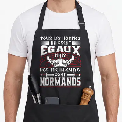Tablier de cuisine noir avec casque viking blanc et texte humoristique sur fond gris uni