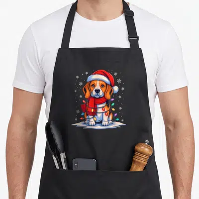 Tablier de cuisine noir avec illustration d'un beagle de Noël mignon portant un bonnet rouge et des lumières festives.