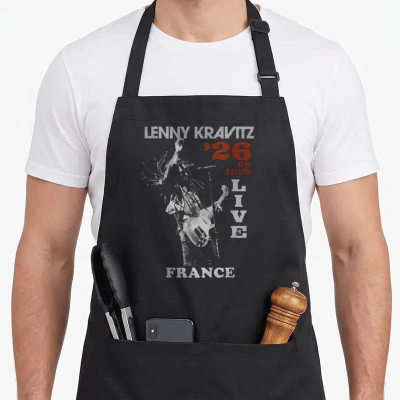 Tablier de cuisine noir avec silhouette guitariste et texte Lenny Kravitz 26 Live France en blanc et rouge.