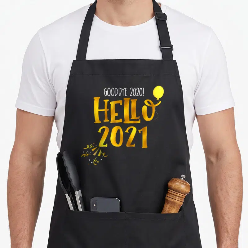 Tablier de cuisine noir avec texte doré Goodbye 2020 Hello 2021 et ballon jaune.