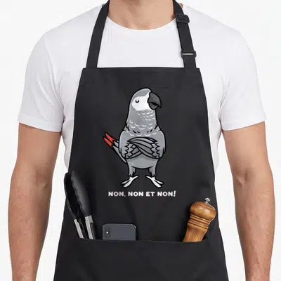 Tablier de cuisine noir avec illustration d'un perroquet jaco aux ailes croisées et la mention Non, non et non en bas.