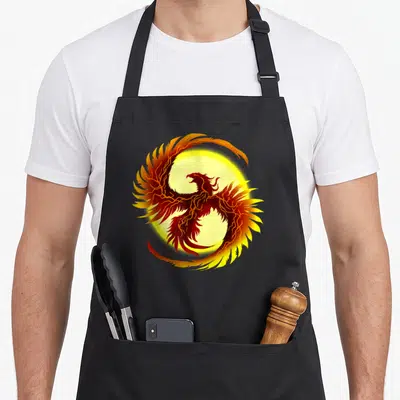 Tablier de cuisine noir avec un Phoenix légendaire aux ailes enflammées et éclairs rouges sur fond jaune circulaire.