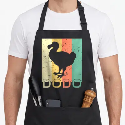 Tablier de cuisine noir avec silhouette dodo grise sur bandes verticales jaune orange et vert turquoise texturées.