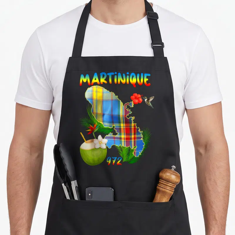 Tablier de cuisine noir avec carte Martinique madras, colibri, coco et fleurs tropicales colorées.