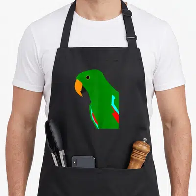 Tablier de cuisine noir avec illustration latérale d'un perroquet vert au bec orange et ailes bleues et rouges.