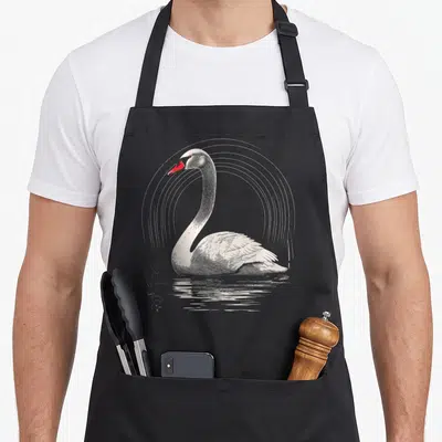 Tablier de cuisine noir avec cygne dessin oiseau art animal graphique en gravure et bec rouge vif.