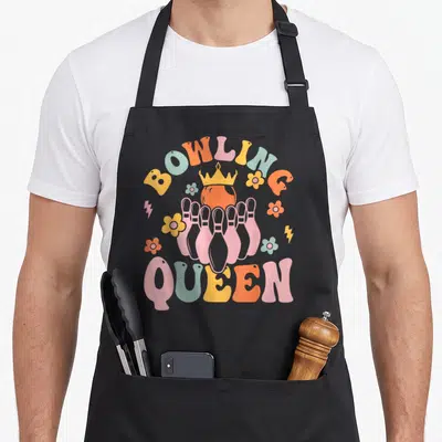 Tablier de cuisine noir avec illustration rétro Bowling Queen pins et couronne pastel