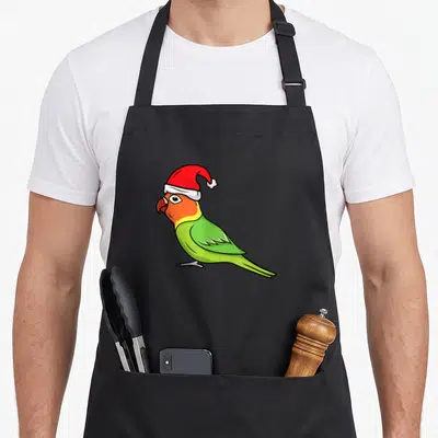 Tablier de cuisine noir avec illustration colorée d'un perroquet portant un bonnet de Père Noël rouge et blanc.