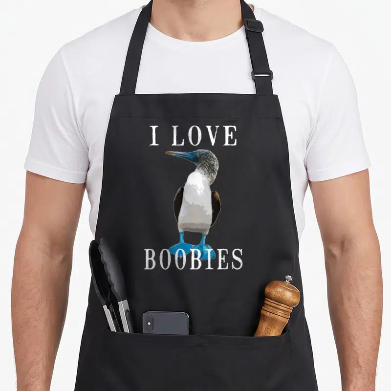 Tablier de cuisine noir avec illustration d'un oiseau aux pieds bleus et texte blanc I LOVE BOOBIES.