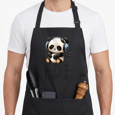 Tablier de cuisine noir avec un ours panda mignon portant des écouteurs bleus et du texte humoristique en anglais.