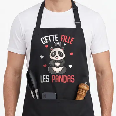 Tablier de cuisine noir avec illustration mignonne d'un panda formant un cœur avec ses pattes.
