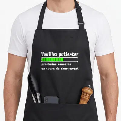 Tablier de cuisine noir avec texte blanc et barre de progression verte sur fond uni.