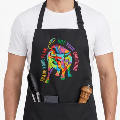 Tablier de cuisine noir avec un taureau multicolore et texte Trade your plan not your emotions