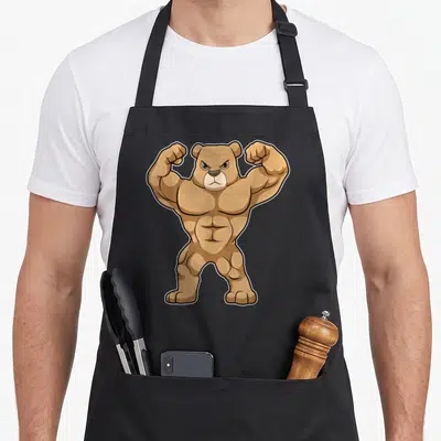 Tablier de cuisine noir avec un ours bodybuilder musclé en train de flexer ses bras.