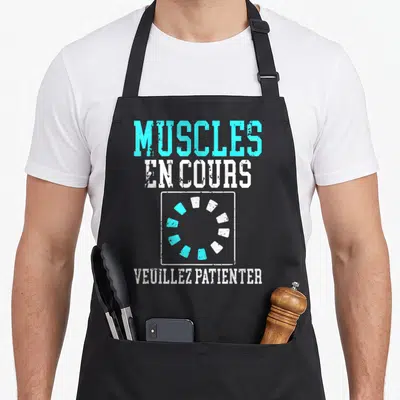 Tablier de cuisine noir avec inscription muscles en cours et icône de chargement circulaire turquoise et blanche.