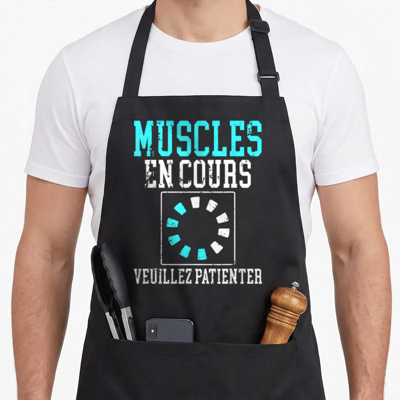 Tablier de cuisine noir avec inscription muscles en cours et icône de chargement circulaire turquoise et blanche.