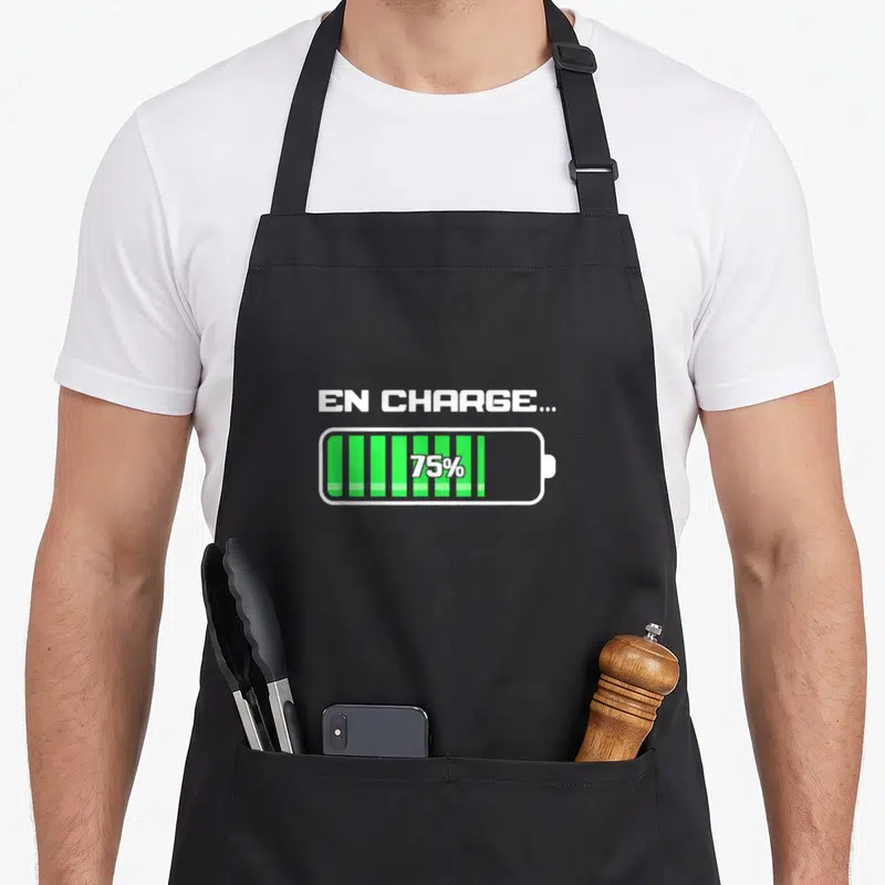 Tablier de cuisine noir avec illustration batterie verte et texte blanc En charge 75 pourster