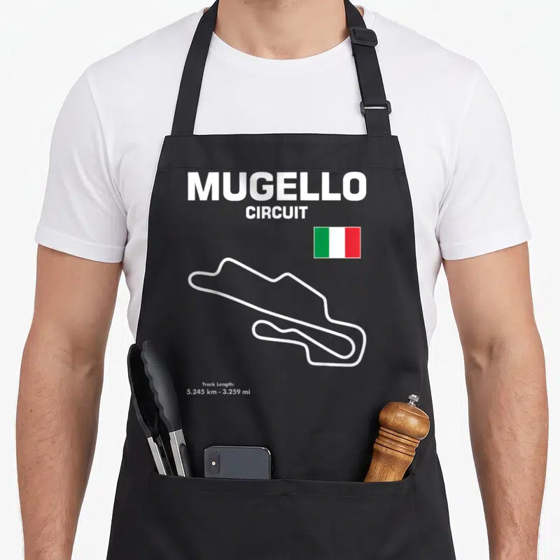 Tablier de cuisine noir avec tracé blanc circuit Mugello, drapeau italien et texte dimensions.