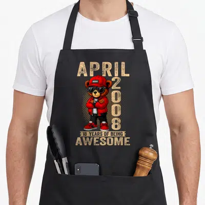 Tablier de cuisine noir avec ours en peluche vêtu de rouge, lunettes noires et texte April 2008.