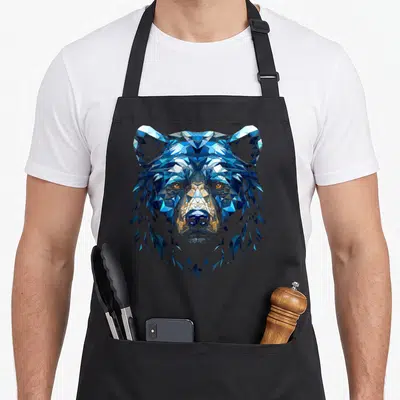 Tablier de cuisine noir avec tête d'ours polygone aux teintes bleues et dorées en illustration graphique.